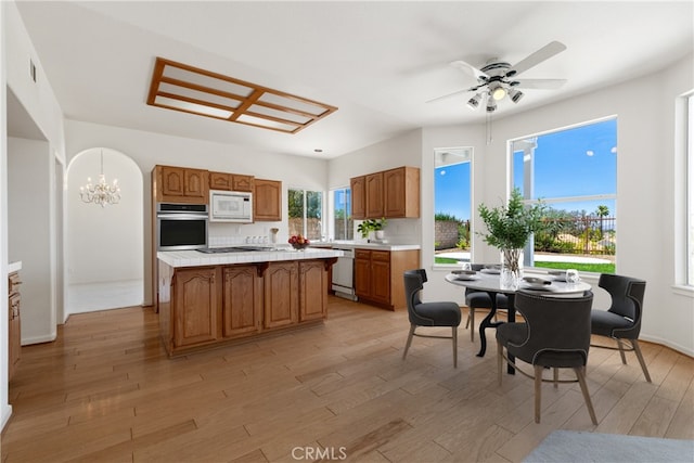 31794 Corte Rosario, Temecula, CA 92592 - kitchen featuring stainless steel appliances, a kitchen island, light countertops, and brown cabinets