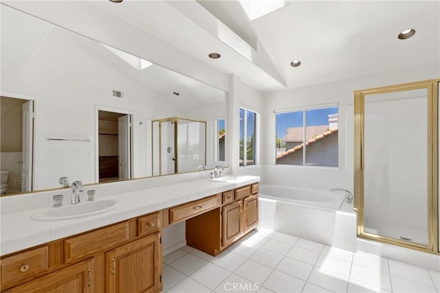 31794 Corte Rosario, Temecula, CA 92592 - full bath with vaulted ceiling, a stall shower, a bath, double vanity, and tile patterned flooring