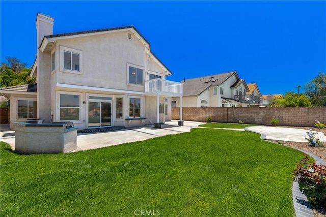 31794 Corte Rosario, Temecula, CA 92592 - rear view of property with a balcony, a chimney, a patio, and stucco siding