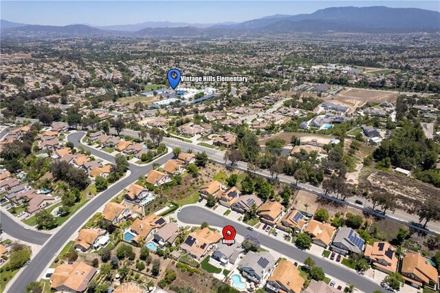 31794 Corte Rosario, Temecula, CA 92592 - aerial overview of property's location with a mountain backdrop and nearby suburban area