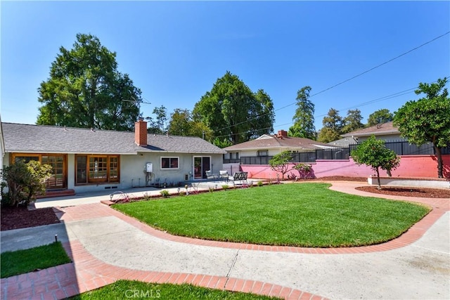 8150 Ocean View Ave, Whittier, CA 90602 - rear view of property featuring a chimney, a patio, and stucco siding