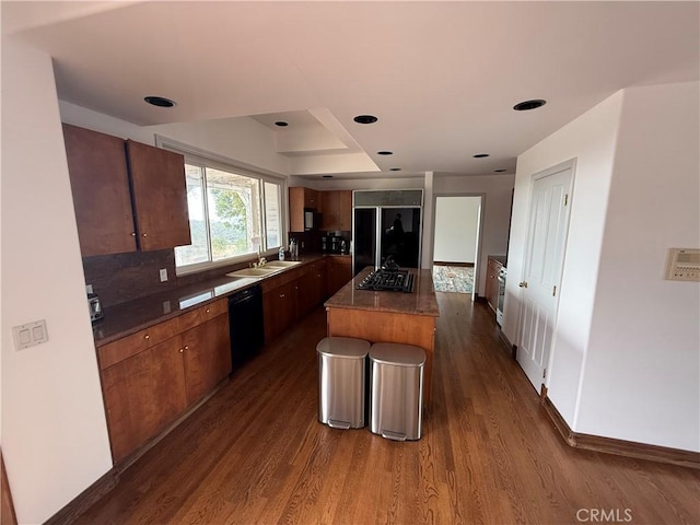5755 Boulder Creek Rd, Julian, CA 92036 - kitchen with black appliances, dark wood-style flooring, a center island, decorative backsplash, and dark countertops