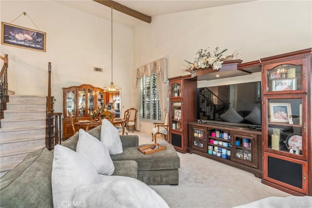 2252 Verbena Ave, Upland, CA 91784 - carpeted living room with stairs, beamed ceiling, and high vaulted ceiling