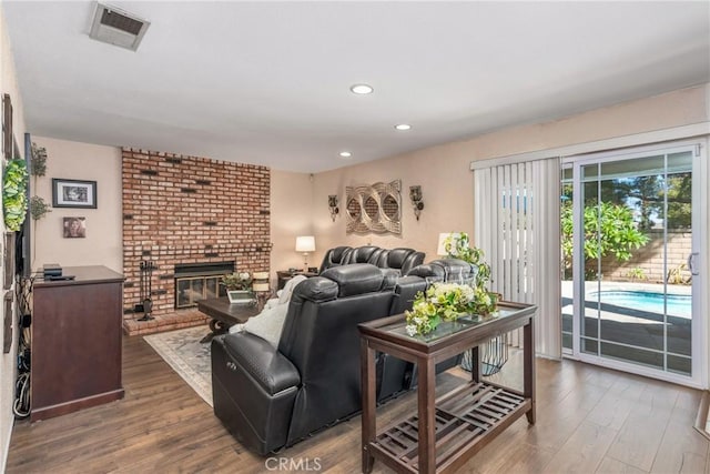 2252 Verbena Ave, Upland, CA 91784 - living area featuring wood finished floors, a fireplace, and recessed lighting