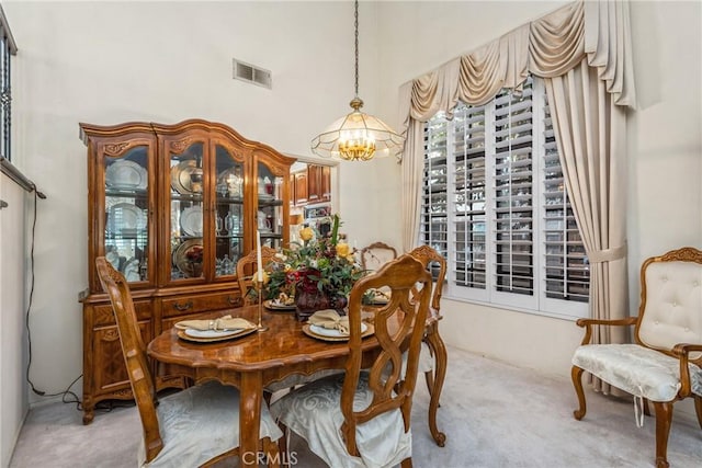 2252 Verbena Ave, Upland, CA 91784 - dining space featuring light colored carpet and a chandelier