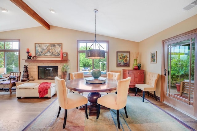 23007 Arjo Ln, Ramona, CA 92065 - dining area with light wood-style floors, healthy amount of natural light, and a brick fireplace