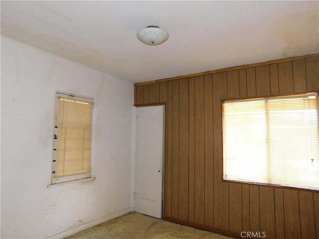 10852 Otsego St, North Hollywood, CA 91601 - unfurnished room with wood walls and baseboards