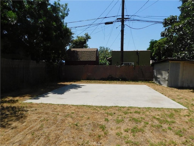 10852 Otsego St, North Hollywood, CA 91601 - fenced backyard featuring a patio area and a storage unit