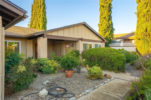 173 Butler Ct, Claremont, CA 91711 - view of property exterior with stucco siding, board and batten siding, and roof with shingles