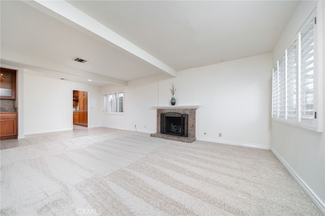 173 Butler Ct, Claremont, CA 91711 - unfurnished living room featuring light carpet and a fireplace with raised hearth