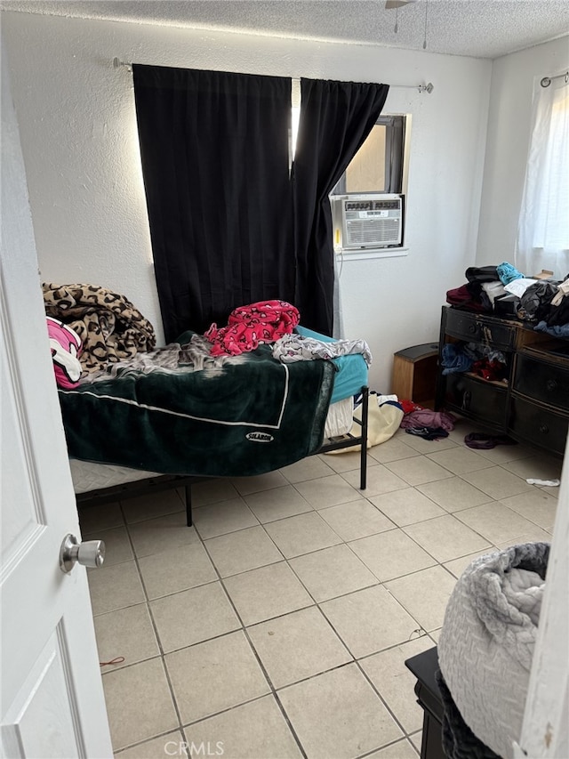 1108 N Rinaldi St, Visalia, CA 93291 - bedroom with cooling unit, light tile patterned floors, and a textured ceiling