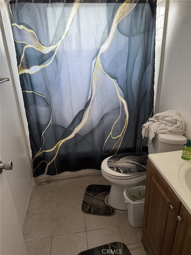 1108 N Rinaldi St, Visalia, CA 93291 - full bath with tile patterned floors, vanity, and a shower with curtain
