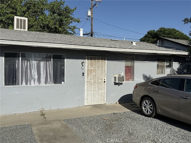 1108 N Rinaldi St, Visalia, CA 93291 - view of home's exterior with a shingled roof and cooling unit