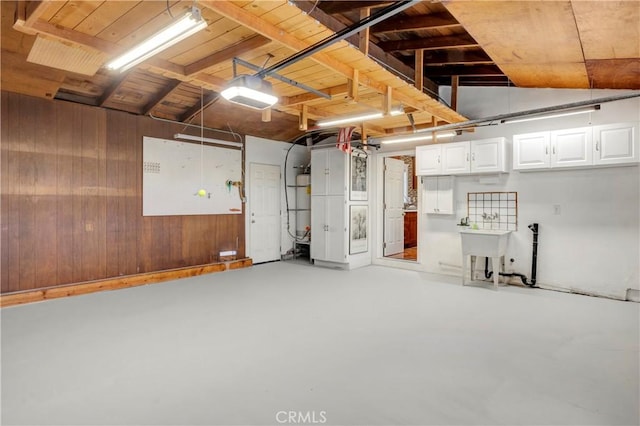 6232 Richmond Ave, Garden Grove, CA 92845 - garage with a garage door opener and wooden walls