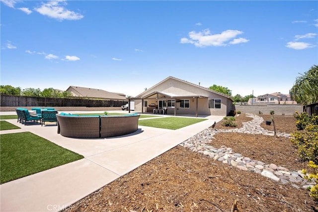 19205 Sterling Hill Ln, Perris, CA 92570 - back of property featuring an outdoor hangout area, a fenced backyard, and a patio area