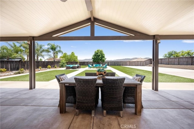 19205 Sterling Hill Ln, Perris, CA 92570 - fenced backyard featuring a patio, outdoor dining space, and an outdoor hangout area
