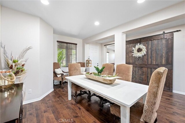 19205 Sterling Hill Ln, Perris, CA 92570 - dining room featuring a barn door, recessed lighting, and wood finished floors