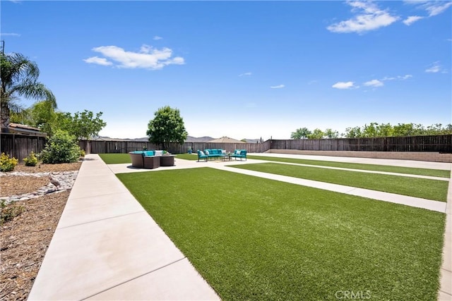 19205 Sterling Hill Ln, Perris, CA 92570 - fenced backyard featuring an outdoor living space and a patio area