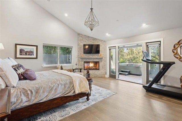 24311 Sylvan Glen Rd, Calabasas, CA 91302 - bedroom featuring access to outside, wood finished floors, a fireplace, high vaulted ceiling, and recessed lighting