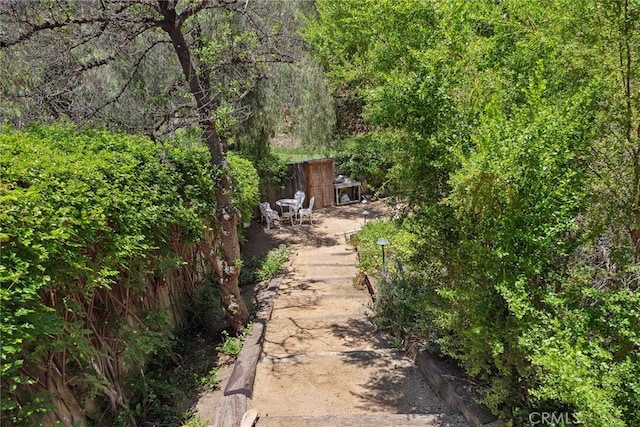 24311 Sylvan Glen Rd, Calabasas, CA 91302 - view of yard with a view of trees