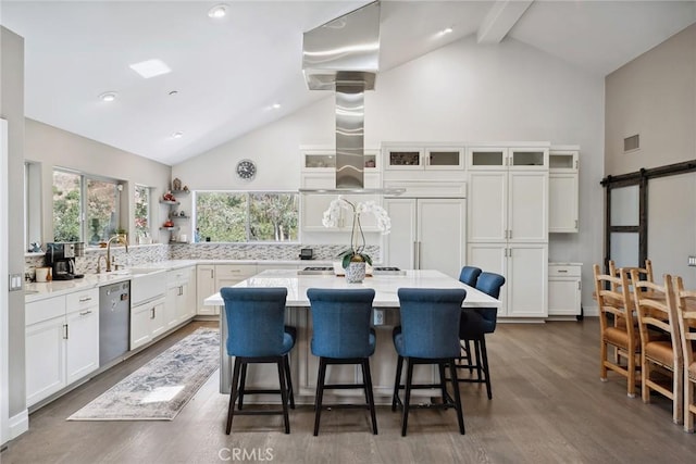 24311 Sylvan Glen Rd, Calabasas, CA 91302 - kitchen featuring stainless steel dishwasher, high vaulted ceiling, white cabinets, a kitchen bar, and dark wood-style floors