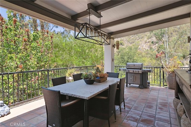 24311 Sylvan Glen Rd, Calabasas, CA 91302 - view of patio featuring a grill, a ceiling fan, outdoor dining space, and a forest view
