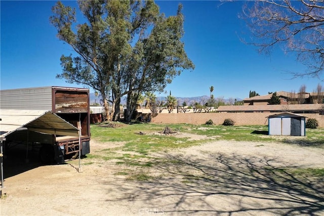 193 N Maple Ave, Fontana, CA 92335 - view of yard with a shed and a mountain view