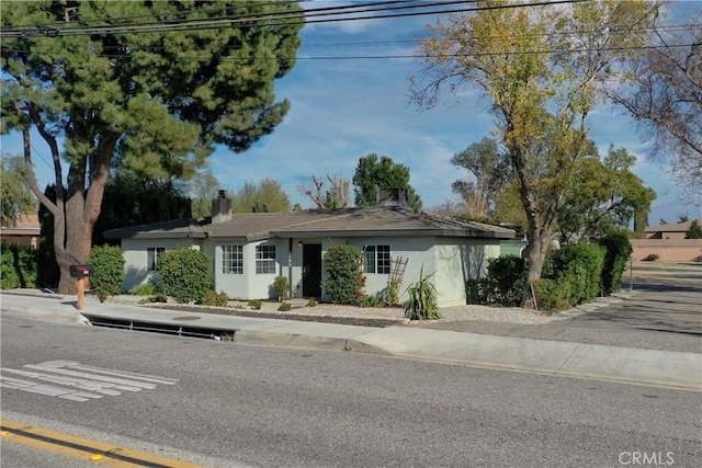 193 N Maple Ave, Fontana, CA 92335 - view of front of home with a chimney and stucco siding