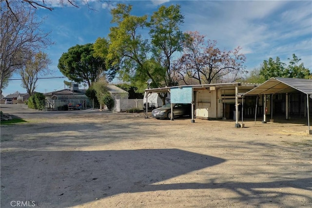 193 N Maple Ave, Fontana, CA 92335 - view of vehicle parking featuring a detached carport