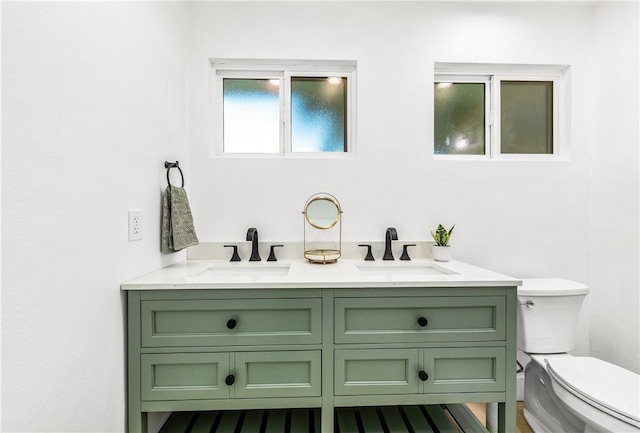 6816 E Driscoll St, Long Beach, CA 90815 - bathroom featuring toilet and double vanity