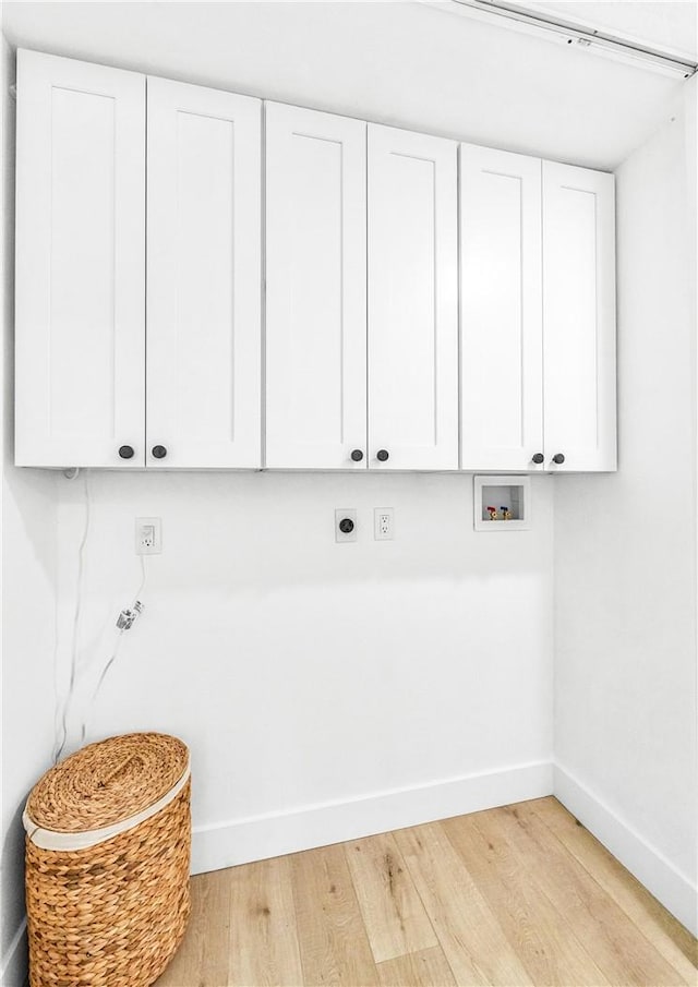 6816 E Driscoll St, Long Beach, CA 90815 - washroom with hookup for an electric dryer, light wood-type flooring, washer hookup, and cabinet space