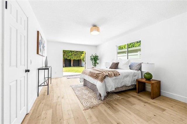 6816 E Driscoll St, Long Beach, CA 90815 - bedroom with access to outside and light wood-style flooring