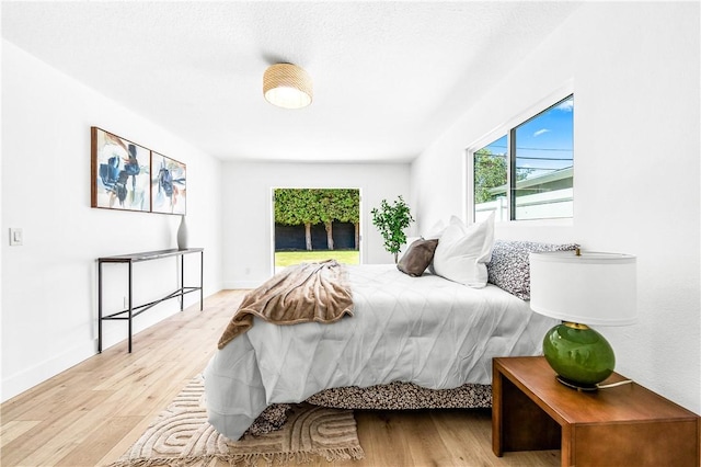 6816 E Driscoll St, Long Beach, CA 90815 - bedroom with wood finished floors and access to exterior