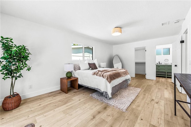 6816 E Driscoll St, Long Beach, CA 90815 - bedroom featuring light wood-style floors and baseboards