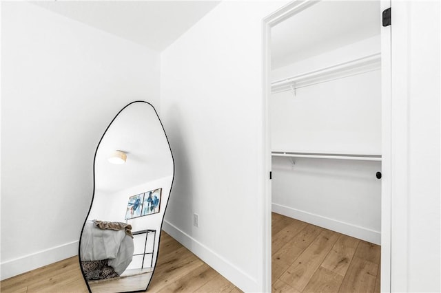 6816 E Driscoll St, Long Beach, CA 90815 - walk in closet featuring wood finished floors