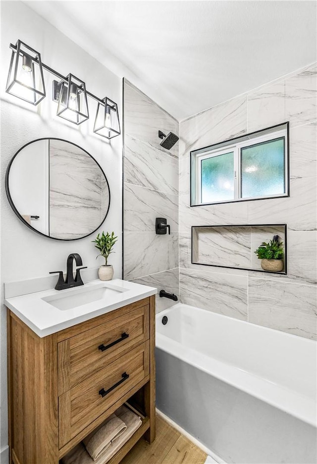 6816 E Driscoll St, Long Beach, CA 90815 - full bathroom featuring vanity, wood finished floors, and shower / bath combination