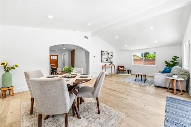 6816 E Driscoll St, Long Beach, CA 90815 - dining space featuring arched walkways, light wood-style floors, and recessed lighting