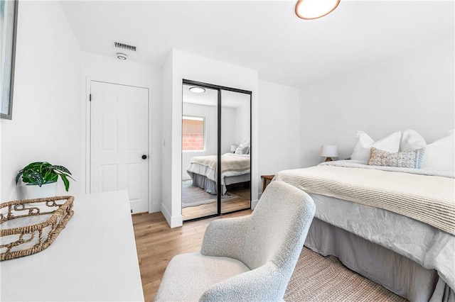 6816 E Driscoll St, Long Beach, CA 90815 - bedroom with light wood-style flooring and a closet
