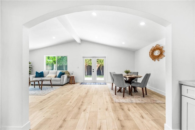 6816 E Driscoll St, Long Beach, CA 90815 - dining space with arched walkways, light wood-style floors, french doors, and recessed lighting