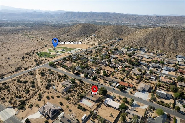 57795 El Dorado Dr, Yucca Valley, CA 92284 - aerial overview of property's location featuring mountains and a desert landscape