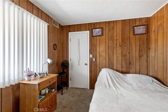 57795 El Dorado Dr, Yucca Valley, CA 92284 - bedroom with light colored carpet, wood walls, and a textured ceiling