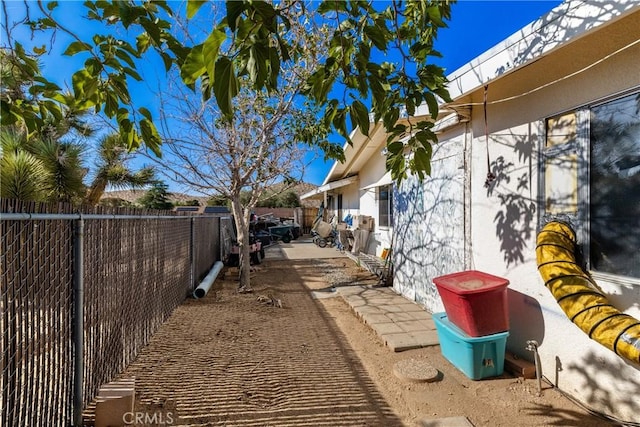 57795 El Dorado Dr, Yucca Valley, CA 92284 - view of side of property with a fenced backyard and a patio area