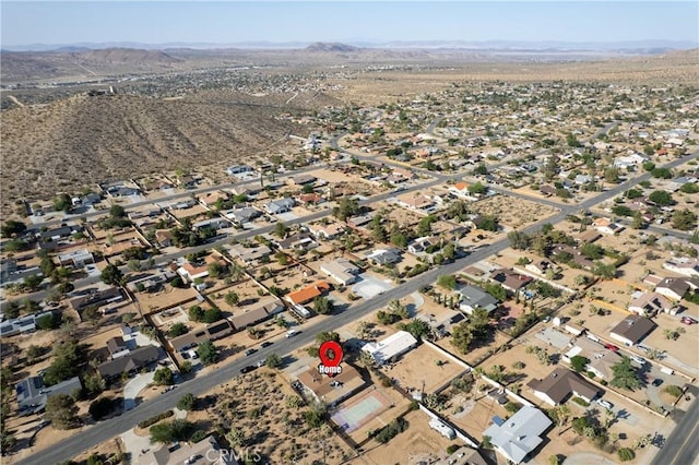 57795 El Dorado Dr, Yucca Valley, CA 92284 - aerial overview of property's location with a mountainous background