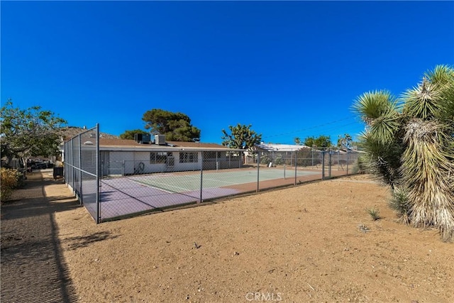 57795 El Dorado Dr, Yucca Valley, CA 92284 - rear view of property with a tennis court