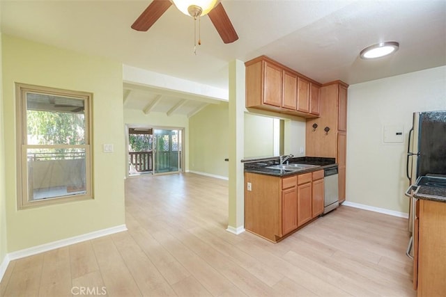 1345 Cabrillo Park Dr Unit A06, Santa Ana, CA 92701 - kitchen with stainless steel dishwasher, light wood finished floors, brown cabinets, and vaulted ceiling