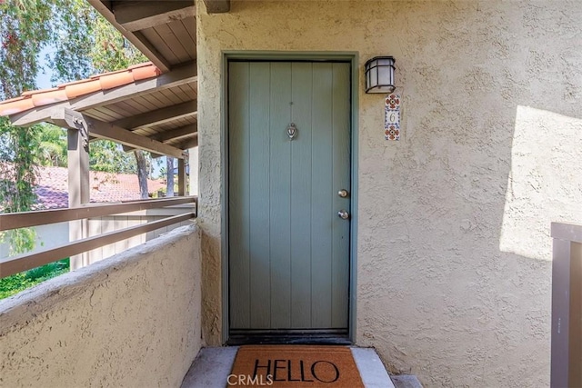 1345 Cabrillo Park Dr Unit A06, Santa Ana, CA 92701 - view of exterior entry featuring stucco siding