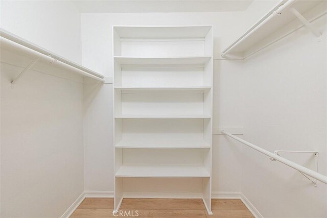 1345 Cabrillo Park Dr Unit A06, Santa Ana, CA 92701 - spacious closet featuring wood finished floors