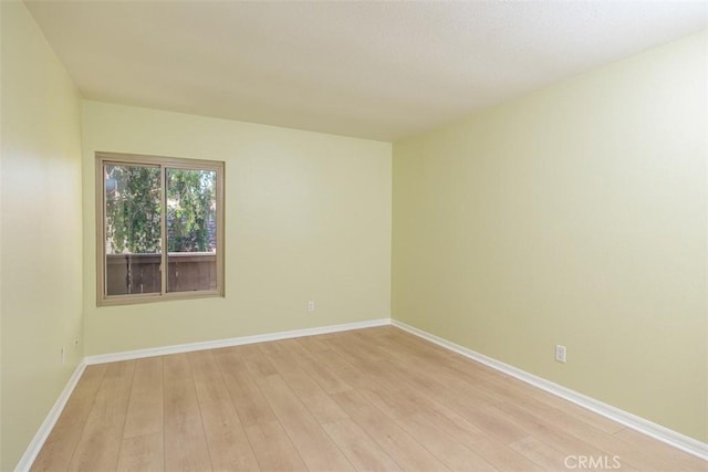 1345 Cabrillo Park Dr Unit A06, Santa Ana, CA 92701 - empty room with light wood-type flooring and baseboards
