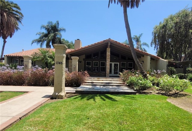 1345 Cabrillo Park Dr Unit A06, Santa Ana, CA 92701 - back of house with french doors, a chimney, stucco siding, and a tiled roof