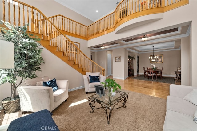 13812 Breeders Cup Dr, Rancho Cucamonga, CA 91739 - living area with stairs, a chandelier, wood finished floors, ornamental molding, and recessed lighting